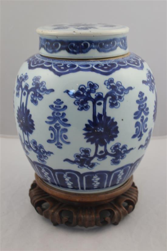 A Chinese blue and white ovoid jar and cover, 19th century, 22.5cm, wood stand